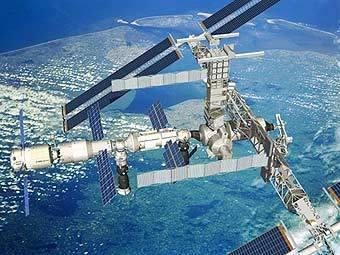 Компьютерная модель стыковки автоматического грузового корабля "Жюль Верн" с МКС. Изображение Европейского космического агентства (ESA), переданное AFP Компьютерная модель стыковки автоматического грузового корабля "Жюль Верн" с МКС. Изображение Европейского космического агентства (ESA), переданное AFP